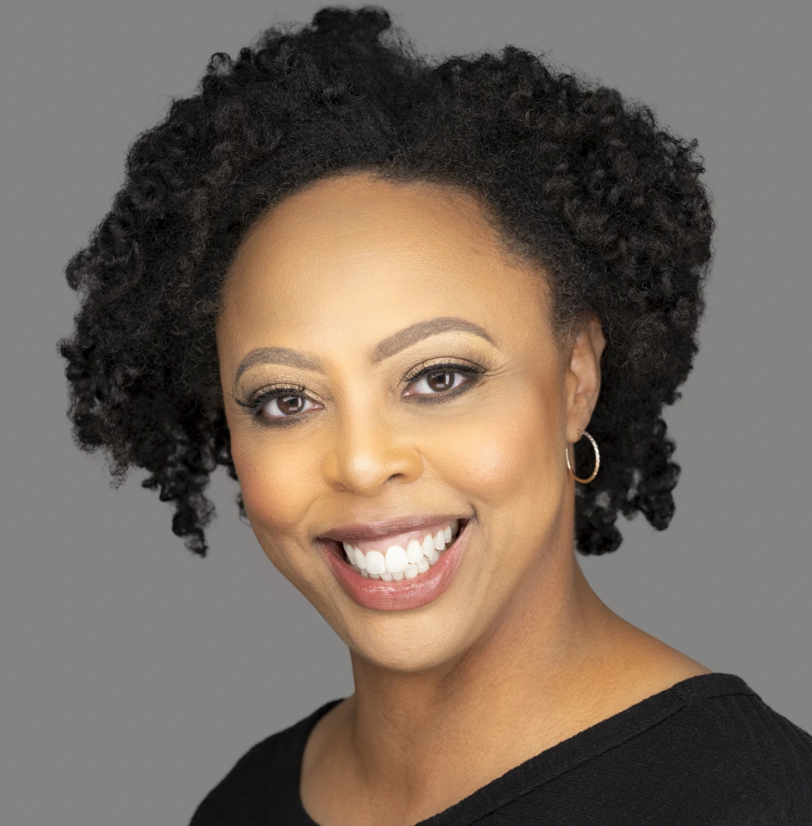 Smiling woman with curly hair